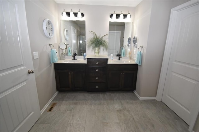 2015 Creek View Ln, Raymore, MO 64083 - bathroom with double vanity and baseboards
