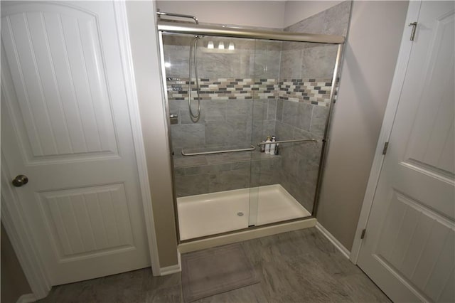 2015 Creek View Ln, Raymore, MO 64083 - bathroom with a shower stall and baseboards