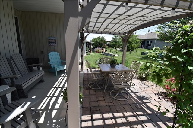 2015 Creek View Ln, Raymore, MO 64083 - view of patio with a pergola and outdoor dining area