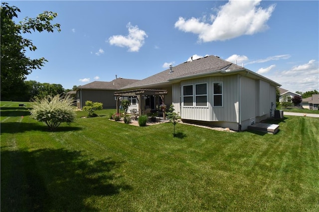 2015 Creek View Ln, Raymore, MO 64083 - back of house with a pergola, a patio area, and a yard
