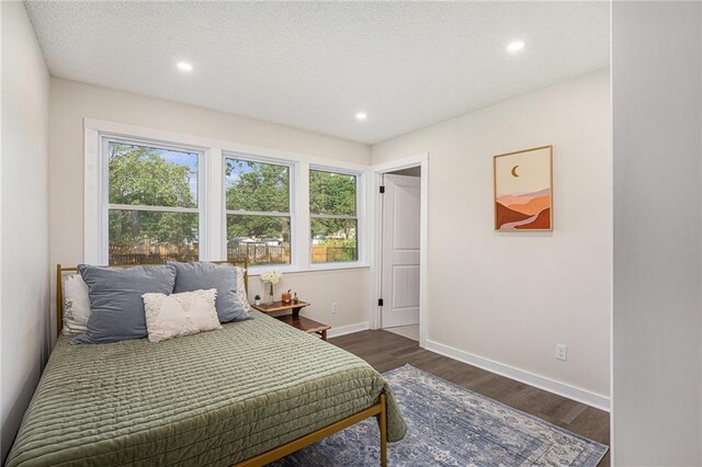 624 S Locust St, Gardner, KS 66030 - bedroom with dark wood finished floors, recessed lighting, and a textured ceiling