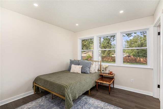 624 S Locust St, Gardner, KS 66030 - bedroom with wood finished floors, recessed lighting, and a textured ceiling