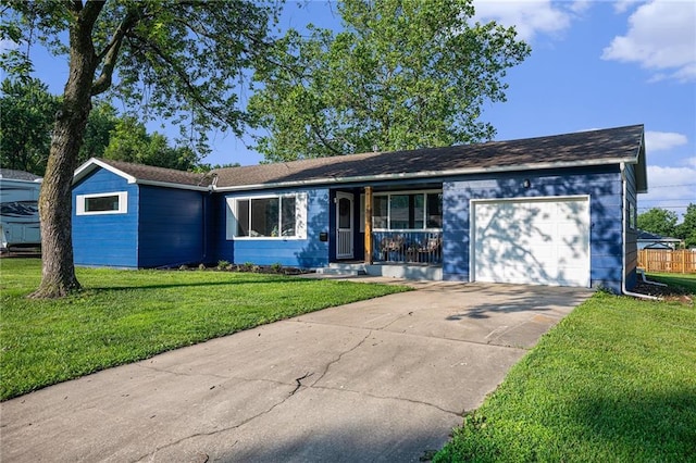 624 S Locust St, Gardner, KS 66030 - ranch-style home featuring a garage, covered porch, a front lawn, and driveway