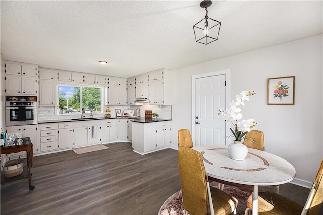 624 S Locust St, Gardner, KS 66030 - dining space with dark wood finished floors and baseboards