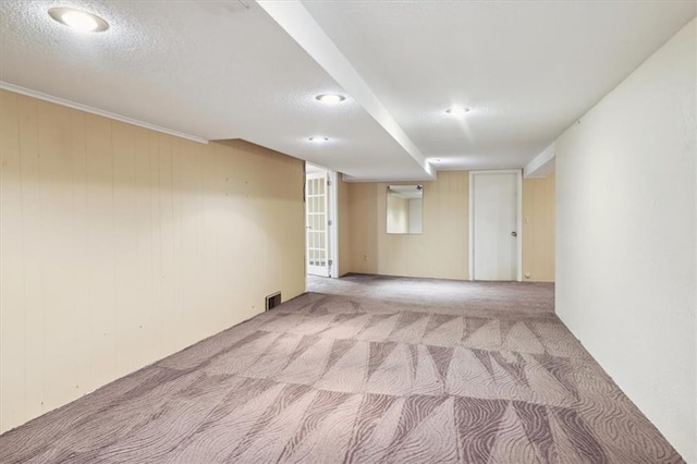 126 W 116th St, Kansas City, MO 64114 - carpeted empty room with wooden walls, recessed lighting, and a textured ceiling