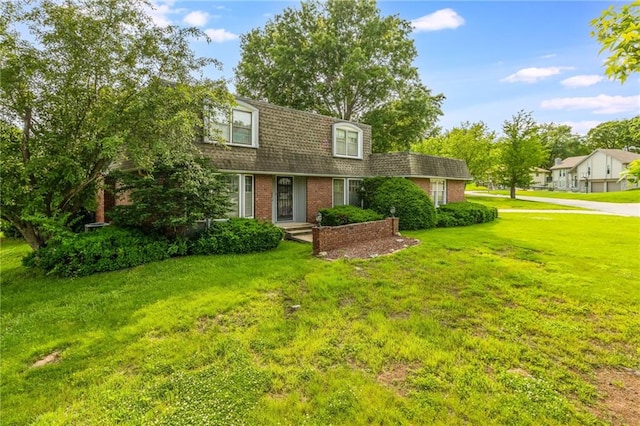 9714 Shepherds Dr, Kansas City, MO 64131 - view of front of property featuring brick siding, a front lawn, and a shingled roof
