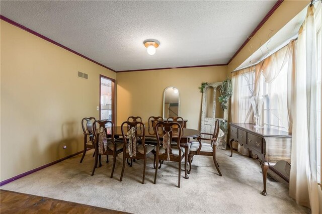 9714 Shepherds Dr, Kansas City, MO 64131 - dining room featuring crown molding, a textured ceiling, carpet floors, and baseboards
