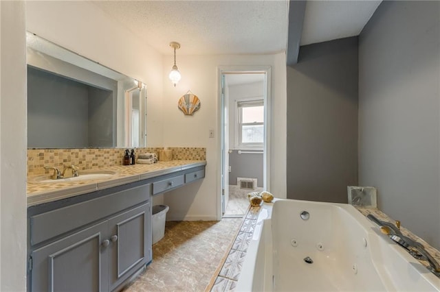 9714 Shepherds Dr, Kansas City, MO 64131 - full bathroom with a tub with jets, vanity, and backsplash