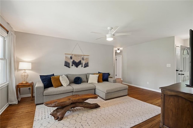 10417 Outlook Dr, Overland Park, KS 66207 - living room with dark wood-style flooring, a ceiling fan, and plenty of natural light