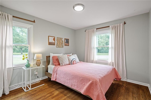 10417 Outlook Dr, Overland Park, KS 66207 - bedroom featuring wood finished floors and multiple windows
