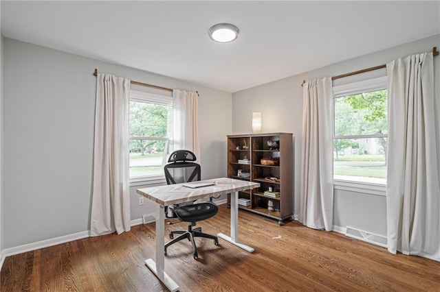 10417 Outlook Dr, Overland Park, KS 66207 - home office with baseboards and wood finished floors