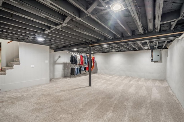 10417 Outlook Dr, Overland Park, KS 66207 - finished below grade area featuring electric panel, stairs, and carpet
