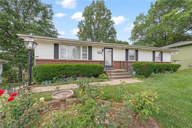 5029 NE 58th St, Kansas City, MO 64119 - single story home featuring brick siding and a front lawn