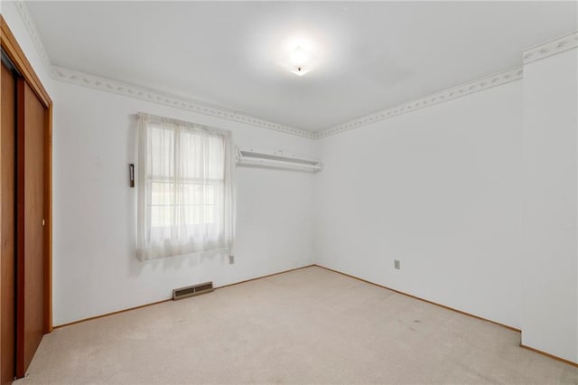 5029 NE 58th St, Kansas City, MO 64119 - unfurnished bedroom with light carpet and a closet