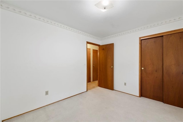 5029 NE 58th St, Kansas City, MO 64119 - unfurnished bedroom featuring light carpet and a closet