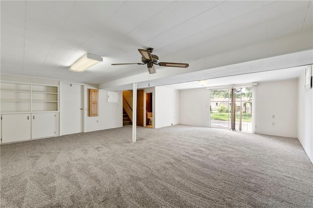 5029 NE 58th St, Kansas City, MO 64119 - carpeted empty room with stairway and a ceiling fan