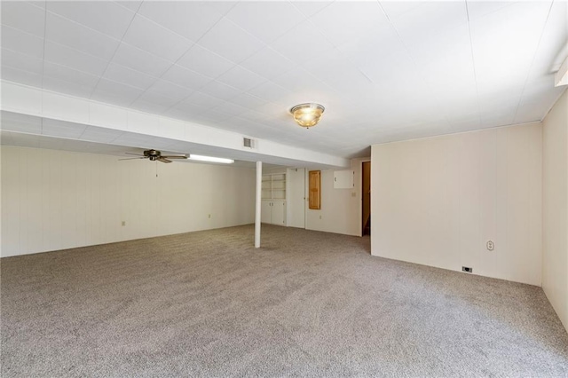 5029 NE 58th St, Kansas City, MO 64119 - finished basement with carpet floors and a ceiling fan