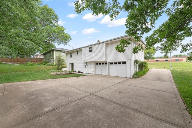 5029 NE 58th St, Kansas City, MO 64119 - view of side of property with a garage and driveway