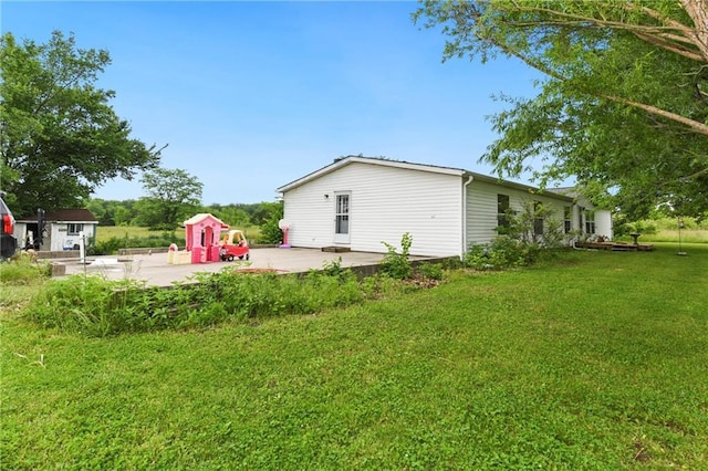 46005 E State Route N, Creighton, MO 64739 - view of green lawn featuring a patio