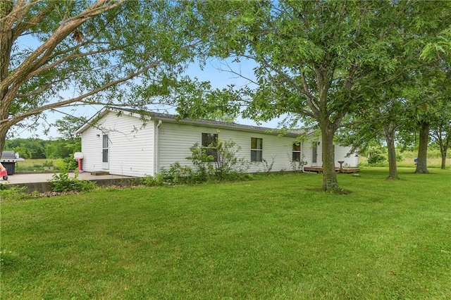 46005 E State Route N, Creighton, MO 64739 - view of green lawn featuring a patio area