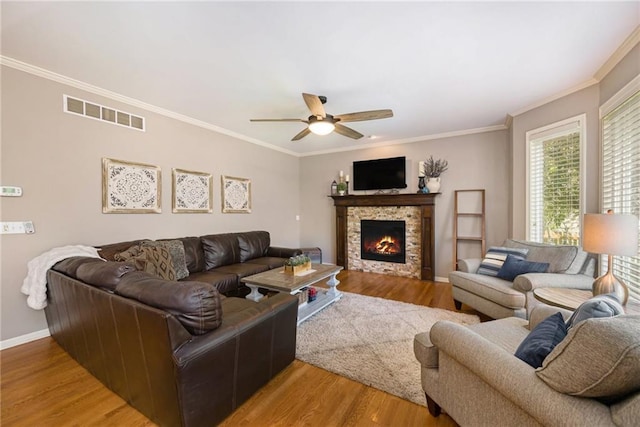 5827 Roundtree St, Shawnee, KS 66226 - living area featuring ceiling fan, crown molding, light wood-style floors, and a fireplace