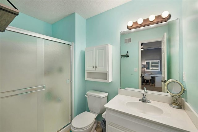 5827 Roundtree St, Shawnee, KS 66226 - bathroom featuring a shower stall, vanity, and a textured ceiling