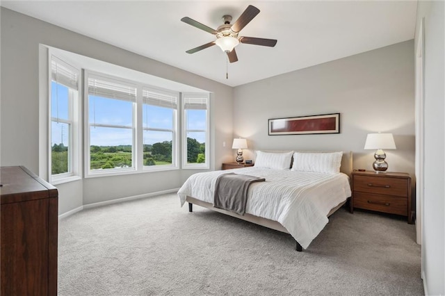 9504 N Amoret Ave, Kansas City, MO 64154 - bedroom featuring carpet, baseboards, and a ceiling fan