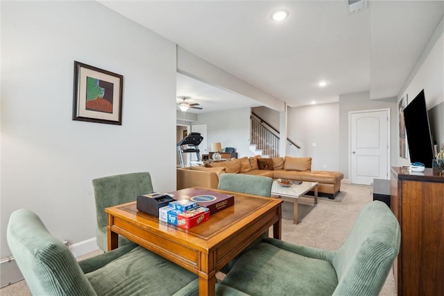 9504 N Amoret Ave, Kansas City, MO 64154 - living room featuring light colored carpet, stairway, baseboards, and recessed lighting