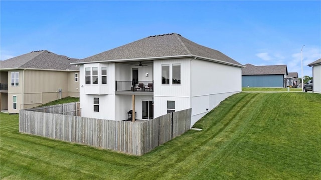 9504 N Amoret Ave, Kansas City, MO 64154 - back of house with a ceiling fan, a balcony, and a shingled roof