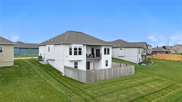 9504 N Amoret Ave, Kansas City, MO 64154 - back of property with a balcony, central air condition unit, a ceiling fan, roof with shingles, and a residential view