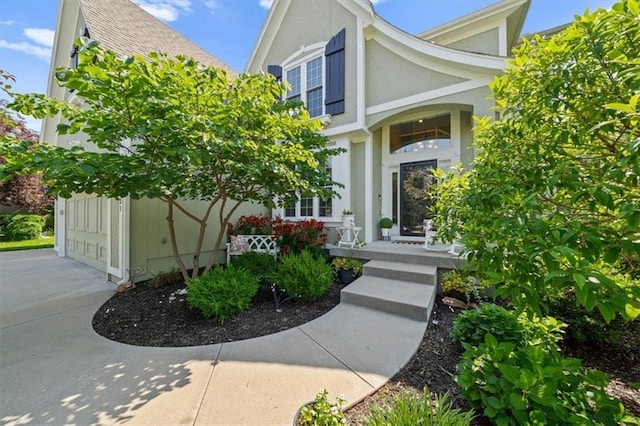 17631 S Brockway St, Olathe, KS 66062 - view of exterior entry with driveway and stucco siding
