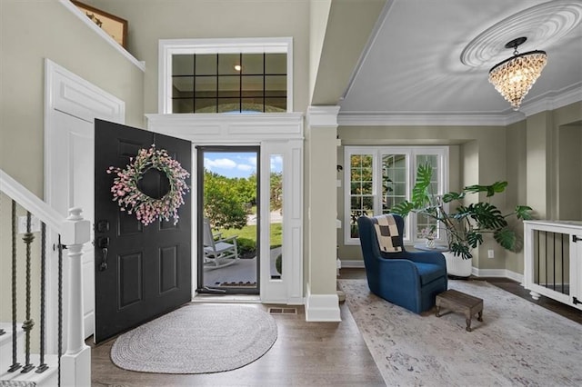 17631 S Brockway St, Olathe, KS 66062 - entrance foyer with a chandelier, wood finished floors, crown molding, and stairs