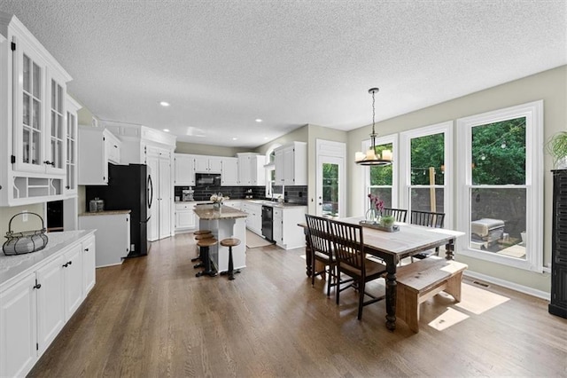 17631 S Brockway St, Olathe, KS 66062 - dining area with a textured ceiling, dark wood-type flooring, and recessed lighting