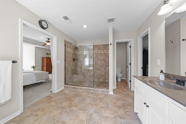 17631 S Brockway St, Olathe, KS 66062 - ensuite bathroom featuring tiled shower, vanity, a ceiling fan, recessed lighting, and a textured ceiling