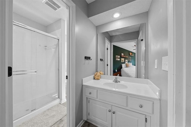 17631 S Brockway St, Olathe, KS 66062 - full bath featuring ensuite bath, a stall shower, vanity, and a textured ceiling