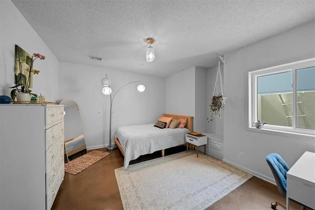 17631 S Brockway St, Olathe, KS 66062 - bedroom featuring a textured ceiling and concrete floors