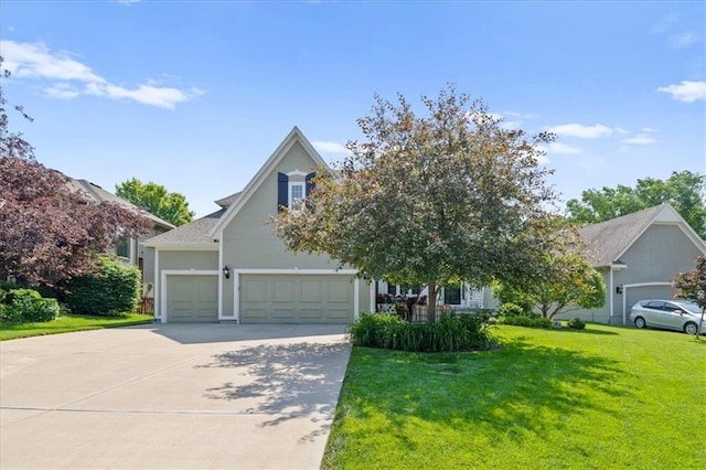 17631 S Brockway St, Olathe, KS 66062 - obstructed view of property with a garage, a front yard, and driveway