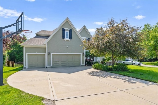 17631 S Brockway St, Olathe, KS 66062 - view of home's exterior with stucco siding, concrete driveway, and a shingled roof