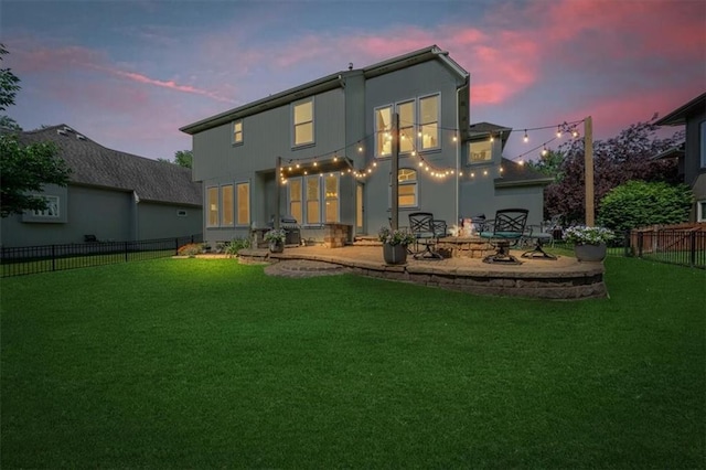 17631 S Brockway St, Olathe, KS 66062 - back of property at dusk with a patio area and a fenced backyard