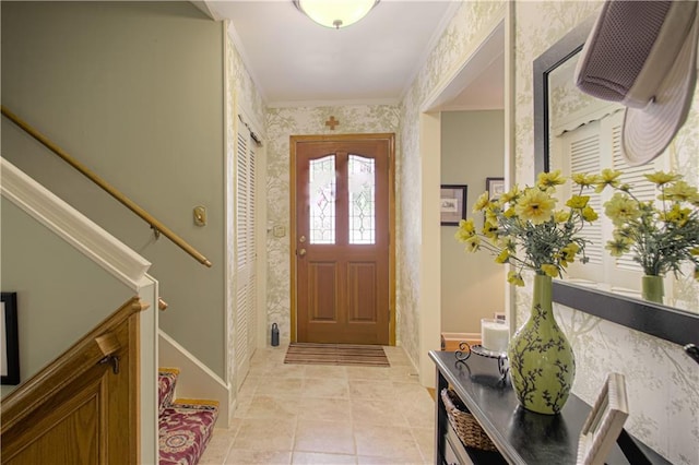 301 W 109th St, Kansas City, MO 64114 - foyer featuring wallpapered walls, ornamental molding, and light tile patterned flooring