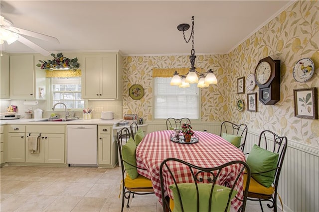 301 W 109th St, Kansas City, MO 64114 - dining room featuring wallpapered walls, a chandelier, crown molding, and a ceiling fan