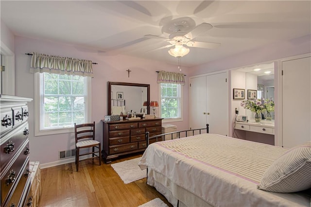 301 W 109th St, Kansas City, MO 64114 - bedroom with light wood-style flooring, a ceiling fan, and a closet