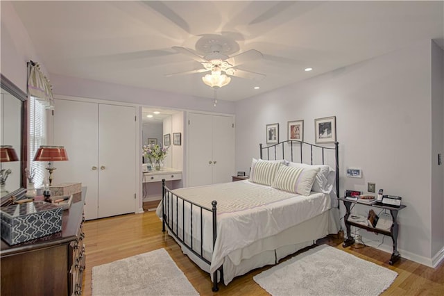 301 W 109th St, Kansas City, MO 64114 - bedroom with light wood-type flooring, multiple closets, recessed lighting, and a ceiling fan