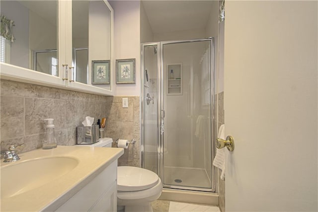 301 W 109th St, Kansas City, MO 64114 - full bathroom with a shower stall, tile walls, vanity, and tile patterned floors