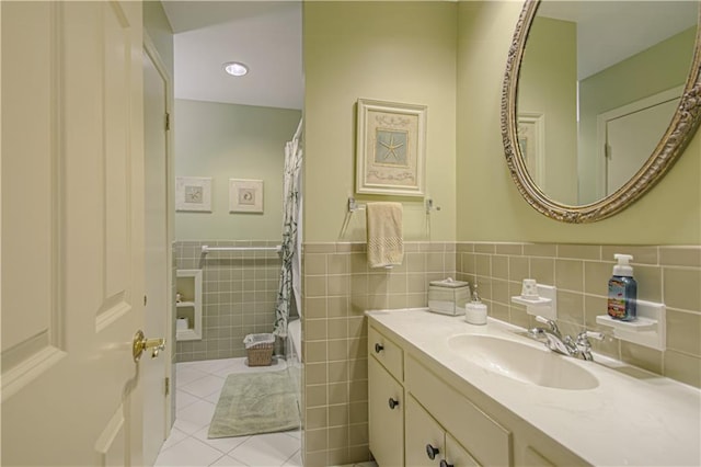 301 W 109th St, Kansas City, MO 64114 - bathroom with vanity, tile patterned floors, tile walls, wainscoting, and a shower with curtain