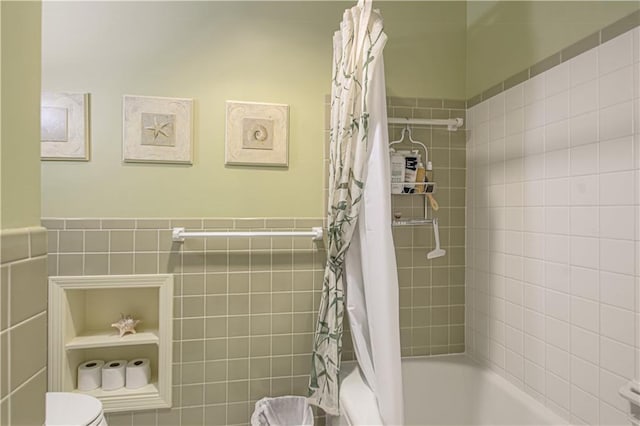 301 W 109th St, Kansas City, MO 64114 - full bath with shower / bath combo with shower curtain, tile walls, and wainscoting
