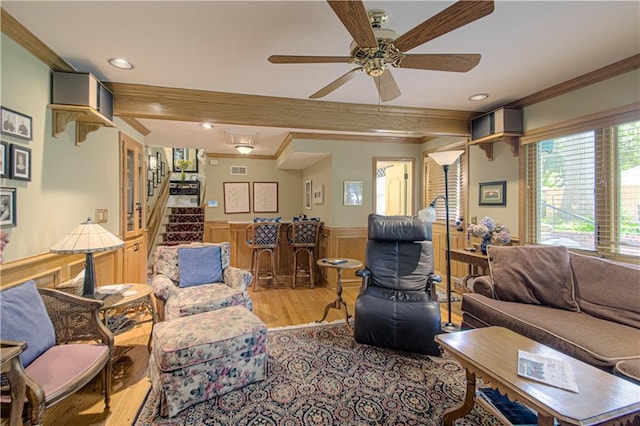 301 W 109th St, Kansas City, MO 64114 - living area with ornamental molding, wainscoting, wood finished floors, a ceiling fan, and recessed lighting