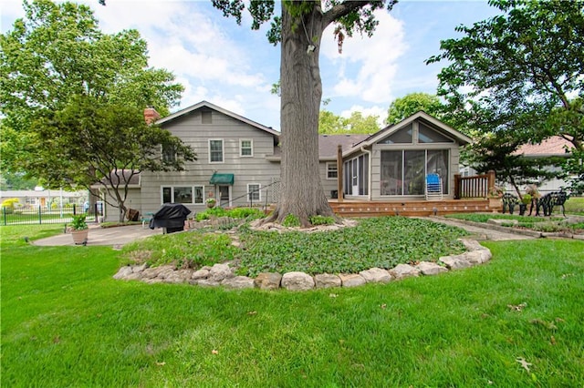 301 W 109th St, Kansas City, MO 64114 - rear view of property with a sunroom, a patio area, and a chimney