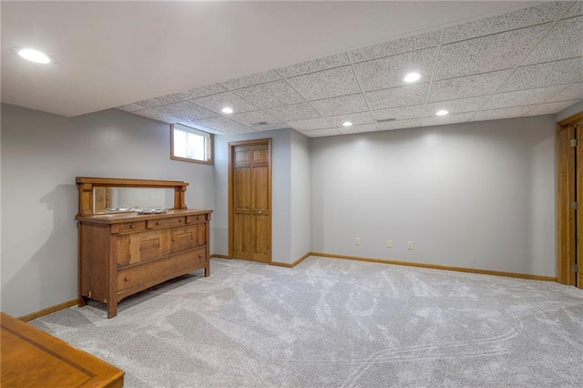 210 SE 200th Rd, Clinton, MO 64735 - below grade area featuring recessed lighting, light carpet, baseboards, and a paneled ceiling