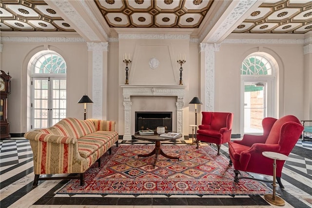 4618 Warwick Blvd Unit 6C, Kansas City, MO 64112 - living area with ornamental molding, coffered ceiling, healthy amount of natural light, a large fireplace, and inlaid floor details